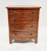 Small mahogany bowfronted chest of four long graduating cockbeaded drawers in the George III manner,