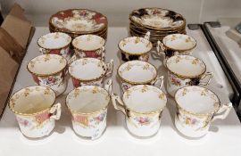 Two sets of six Coalport china coffee cans and saucers, early 20th century, with later replacements,