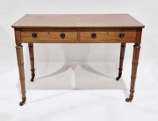 Victorian mahogany side table with rounded corners, two frieze drawers with metal drop ring