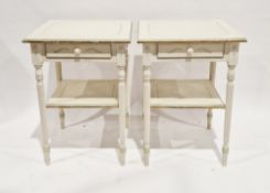 Pair of cream and green painted square side tables, each with single drawer and undershelf, raised