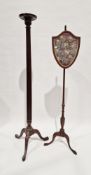 19th century mahogany torchere, the small circular top raised on a turned reeded column and three