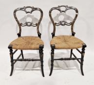 Pair of Victorian black lacquered bedroom chairs with gilt and mother-of-pearl decoration and rush
