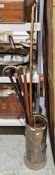 Collection of walking sticks and canes including a brass-topped example, another with gold-