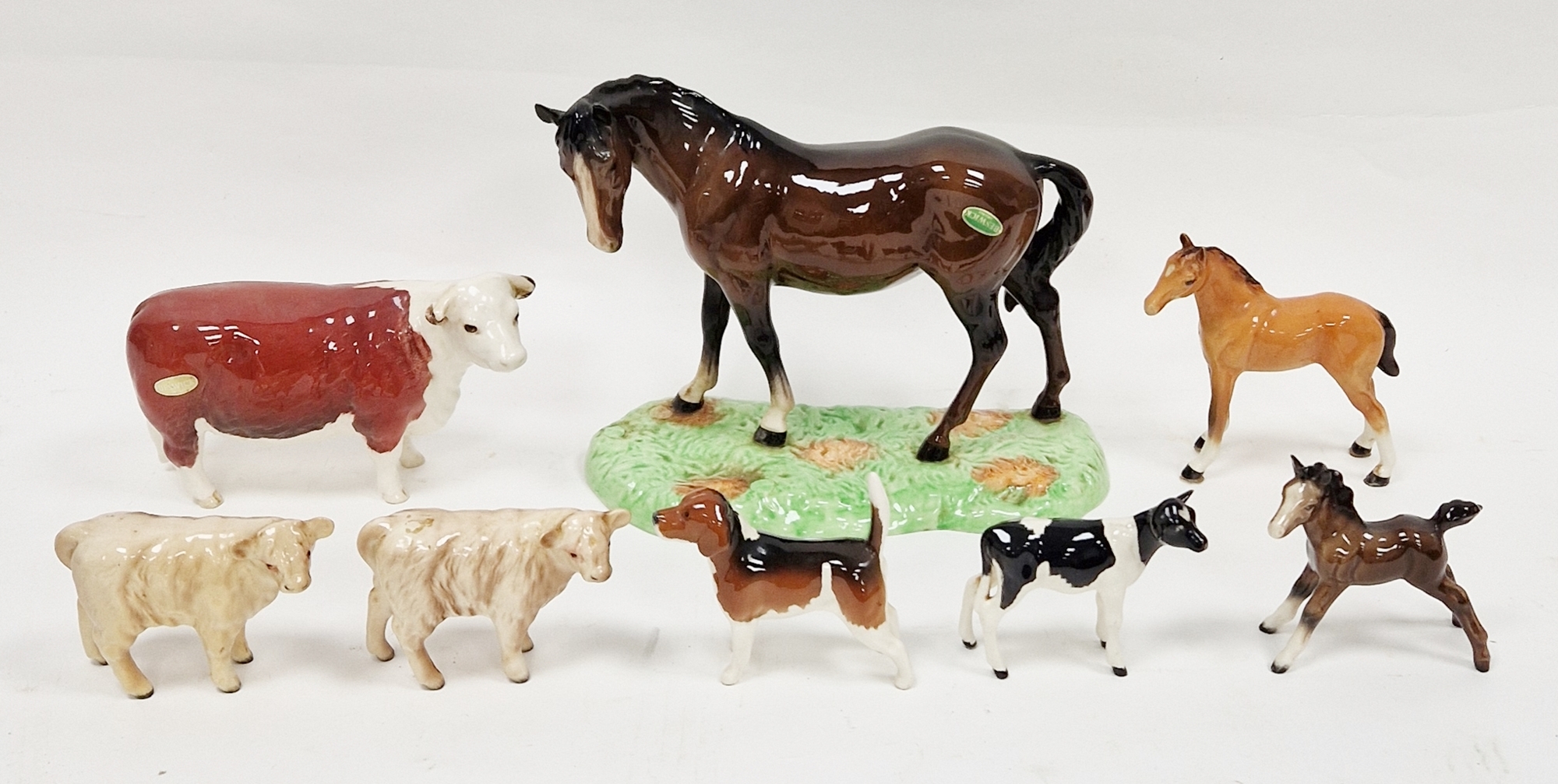Beswick model of a chestnut horse on green base, printed black marks with green and gold label, 23cm