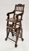 Victorian walnut metamorphic child's high chair raised on iron wheels, 100cm high x 35cm wide