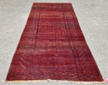 Baluch Afghan main carpet, merlot ground and geometric grid with navy and cream, 374cm x 166cm