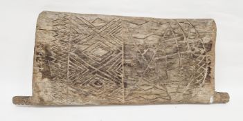 African tribal hardwood door carved to one side with geometric motifs, 97cm x 42cm