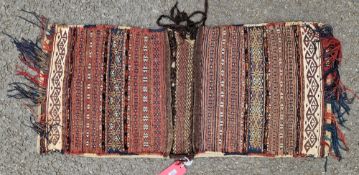 Baluch saddle bag with brocaded west work on brown, gold, cream, blue and turquoise, 120cm x 55cm