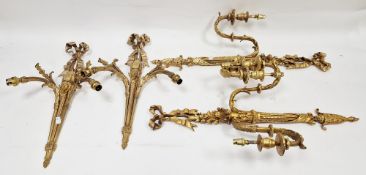 Pair of gilt metal double branch wall lights in the French Louis XVI manner, with ribbon cresting
