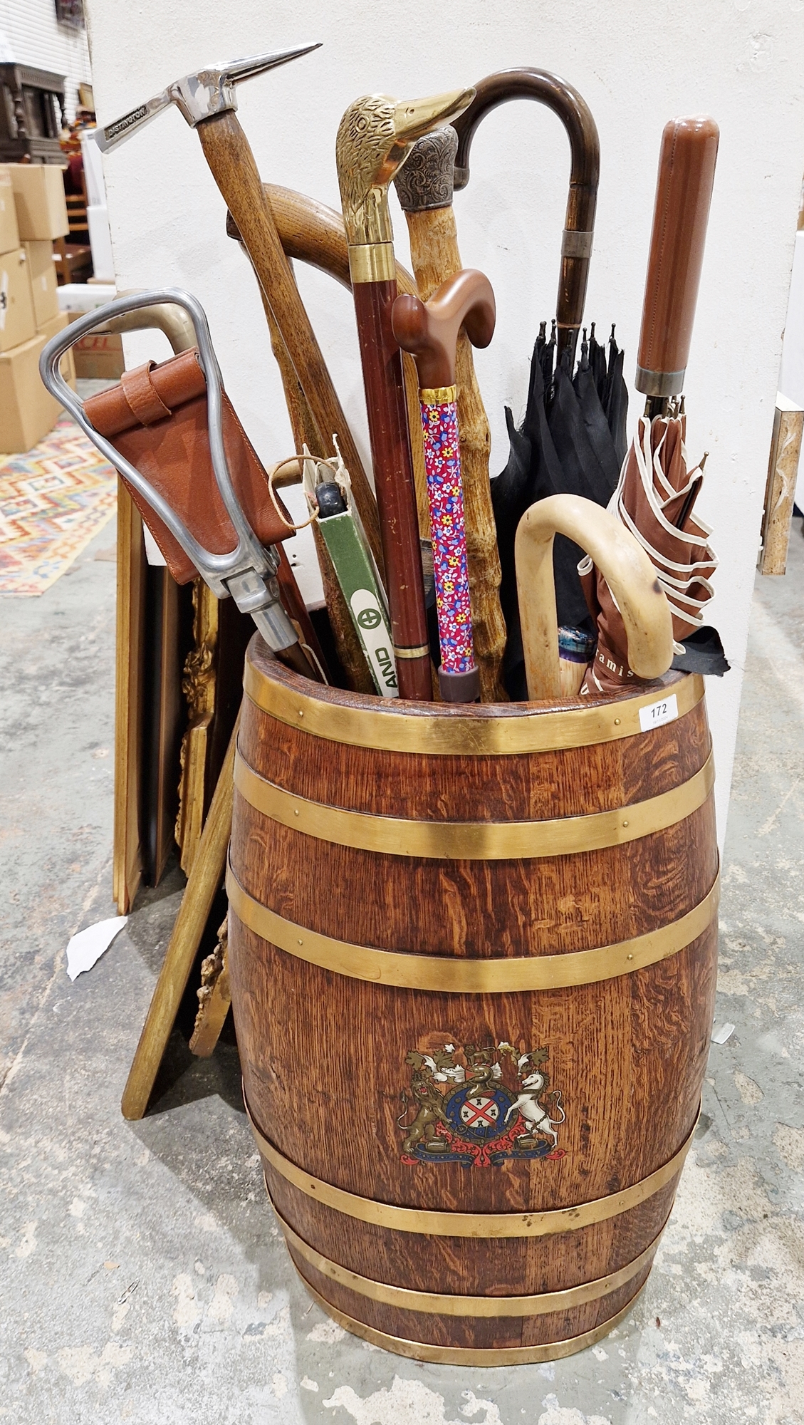 Oak oval coopered and brass-bound stickstand, decorated with the Royal Coat of Arms to side, 62cm