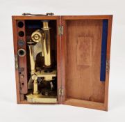 Early 20th century gilt brass microscope by R & J Beck of London, model no. 7999, with spare lenses,