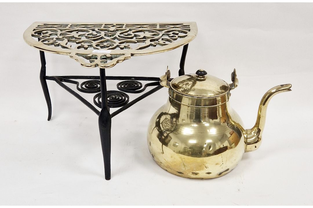 Large 19th century brass and cast iron demi-lune footman with pierced and scrolling decoration, 42cm