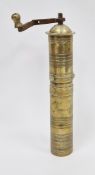 Old Turkish brass coffee grinder with detachable iron turning handle and engraved banded decoration,