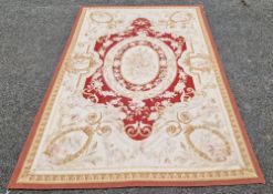 Burgundy ground Aubusson style rug with floral pattern in green and gold ovals, 180cm x 275cm
