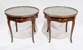 Pair of  mahogany circular side/lamp tables by Baker Furniture, the quarter-veneered tops with