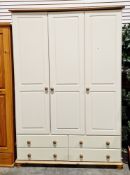 Modern cream-effect and pine triple wardrobe, the three cupboard doors opening to two hanging spaces