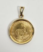 South African 22ct gold 1/10th Krugerrand, 1991, in yellow metal coin pendant mount (unmarked),