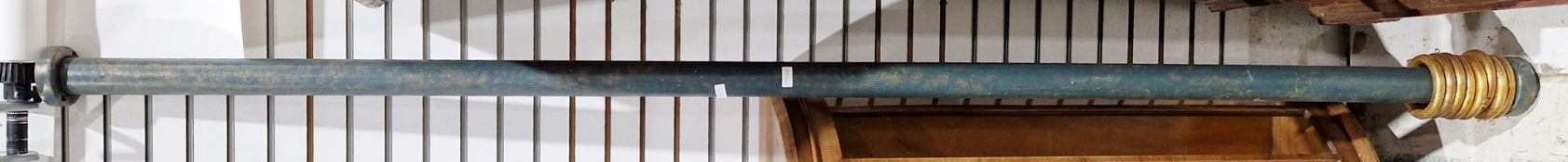 Green painted wooden long curtain rail with eight gold painted rings, 242cm long and a burgundy silk