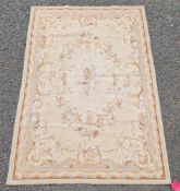 Cream ground Aubusson floral rug in blue, brown, green and floral rose design, 114cm x 181cm