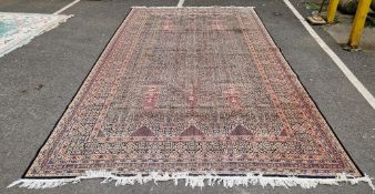 Persian carpet with floral design cream ground, pink, blue, black, green and burgundy borders,