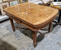 Early 20th century French oak draw-leaf table with parquet top and rounded corners, the apron with