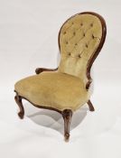 Victorian mahogany framed button back salon chair with yellow upholstery and raised on scrolling