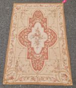Aubusson style terracotta ground rug with pink and green floral design, 114cm x 181cm  Property of