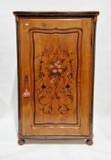 Continental stained pine hall cupboard, the shaped moulded single panel door handpainted with