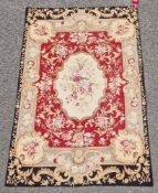 Aubusson style burgundy and cream ground rug with floral rose, cream, green and black border,