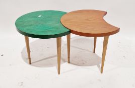 Four similar mid-century side tables, of crescent form, two with a stained green top, each raised on