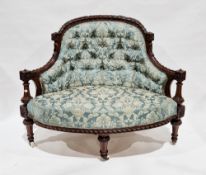 Victorian salon corner chair, the mahogany frame elaborately carved including flowers, scrolling