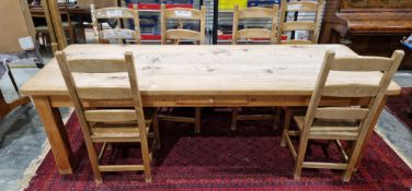 Substantial modern pine dining table raised on square chamfered legs, 78cm high x 244cm long x