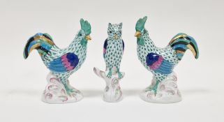 Two Herend porcelain models of cockerels and a model of an owl, printed blue marks, all decorated