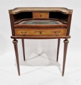 French mahogany writing desk in the Carlton House manner, the shaped back with pierced gilt metal