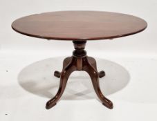 Modern mahogany oval supper table in the Regency manner, raised on a turned baluster support and