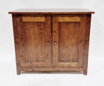 Modern hardwood side cabinet, the two panel doors opening to two shelves, with metal knob handles,