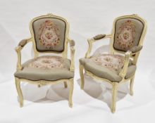 Pair of French open arm chairs in the Louis XV manner, the frames with a white crackled lacquered