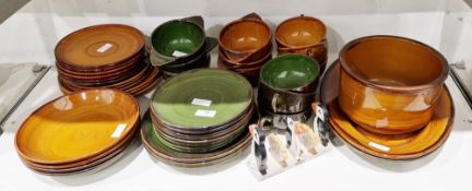 Composite French pottery (St. Clement) part dinner-service, glazed in green and ochre, printed and