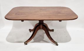Early 19th century mahogany tilt-top supper table, the rectangular top with rounded corners and