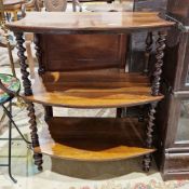 Victorian rosewood three-tier bowfronted whatnot, the shaped shelves supported by barleytwist