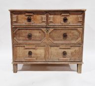 19th century Jacobean revival pale oak chest of two short over two long graduating drawers, the
