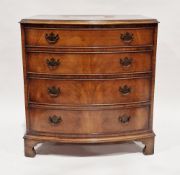 Mahogany bowfronted chest of four long graduating cockbeaded drawers, in the early 19th century
