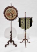 Victorian rosewood polescreen, the circular panel with pierced carved surround, holding a floral