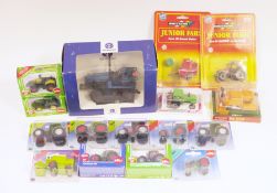 15 boxed and carded diecast farm vehicles including Agritec model New Holland Caterpillar, two