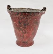 Antique red leather and metal-bound fire bucket with leather handle and studwork, 30cm high