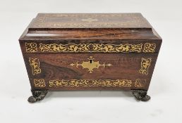Early 19th century rosewood and brass inlaid tea caddy of sarcophagus form, the hinged lid opening