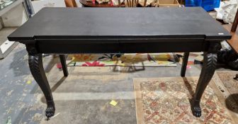 Mahogany serving table in the George III Irish manner, later painted black, the frieze with two