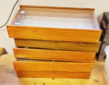 Five light oak effect wall hanging collector's display cabinets, each with clear sliding front