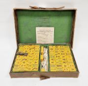 Early 20th century Chinese travelling mah-jong set with yellow polymer and bone playing pieces