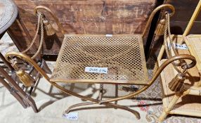 Gilt metal dressing stool with scrolling arms terminating in rope and tassels, raised on an X-